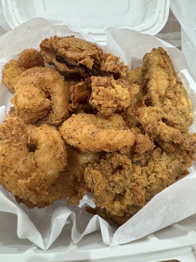 Plates of crispy fish and hush puppies