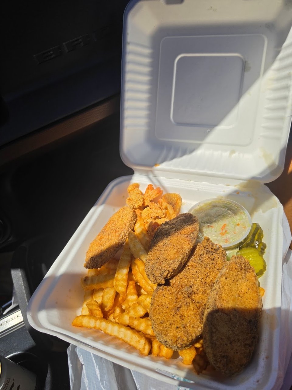 Printed menu featuring red snapper and fries